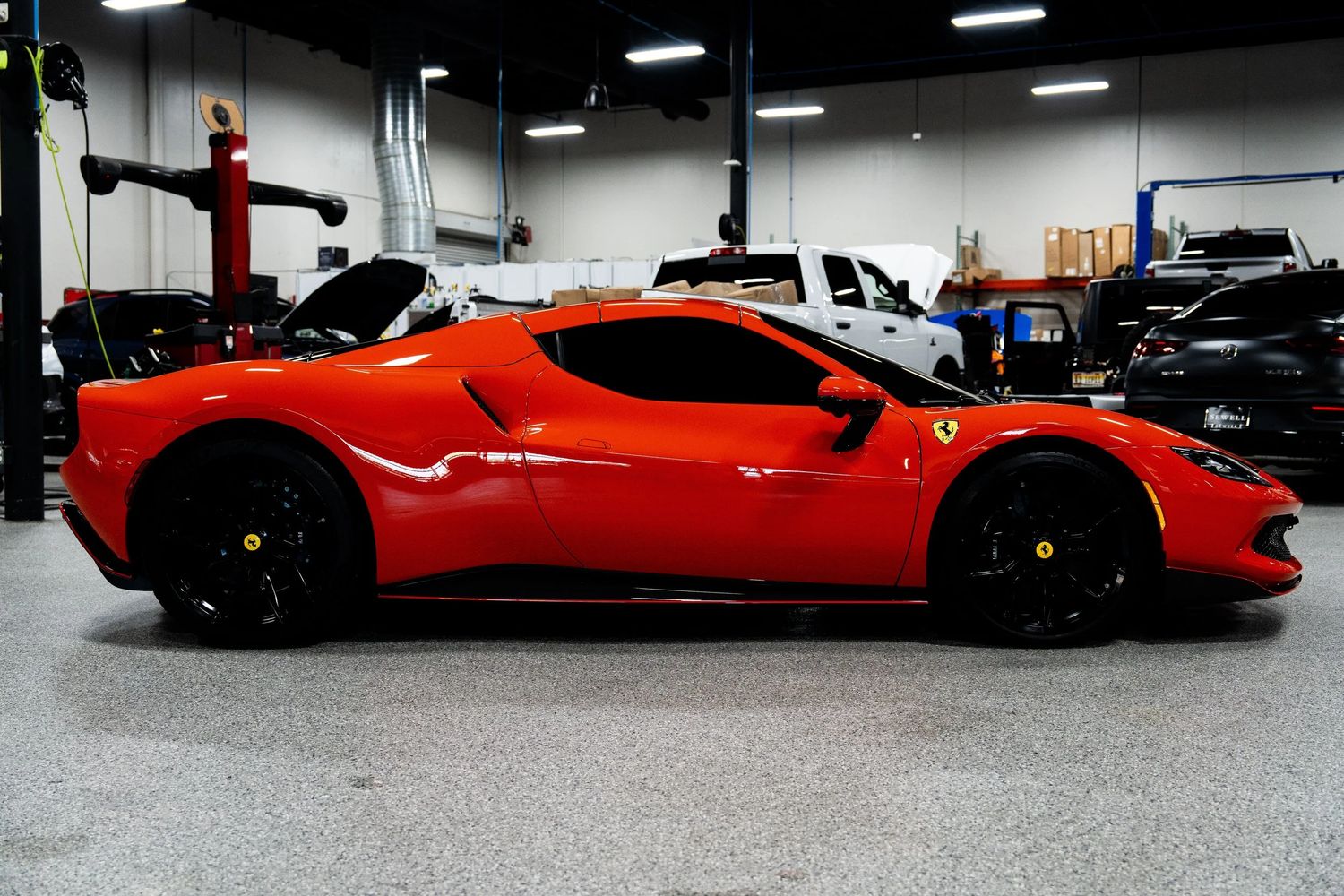 Ferrari 296 GTB in a workshop bay