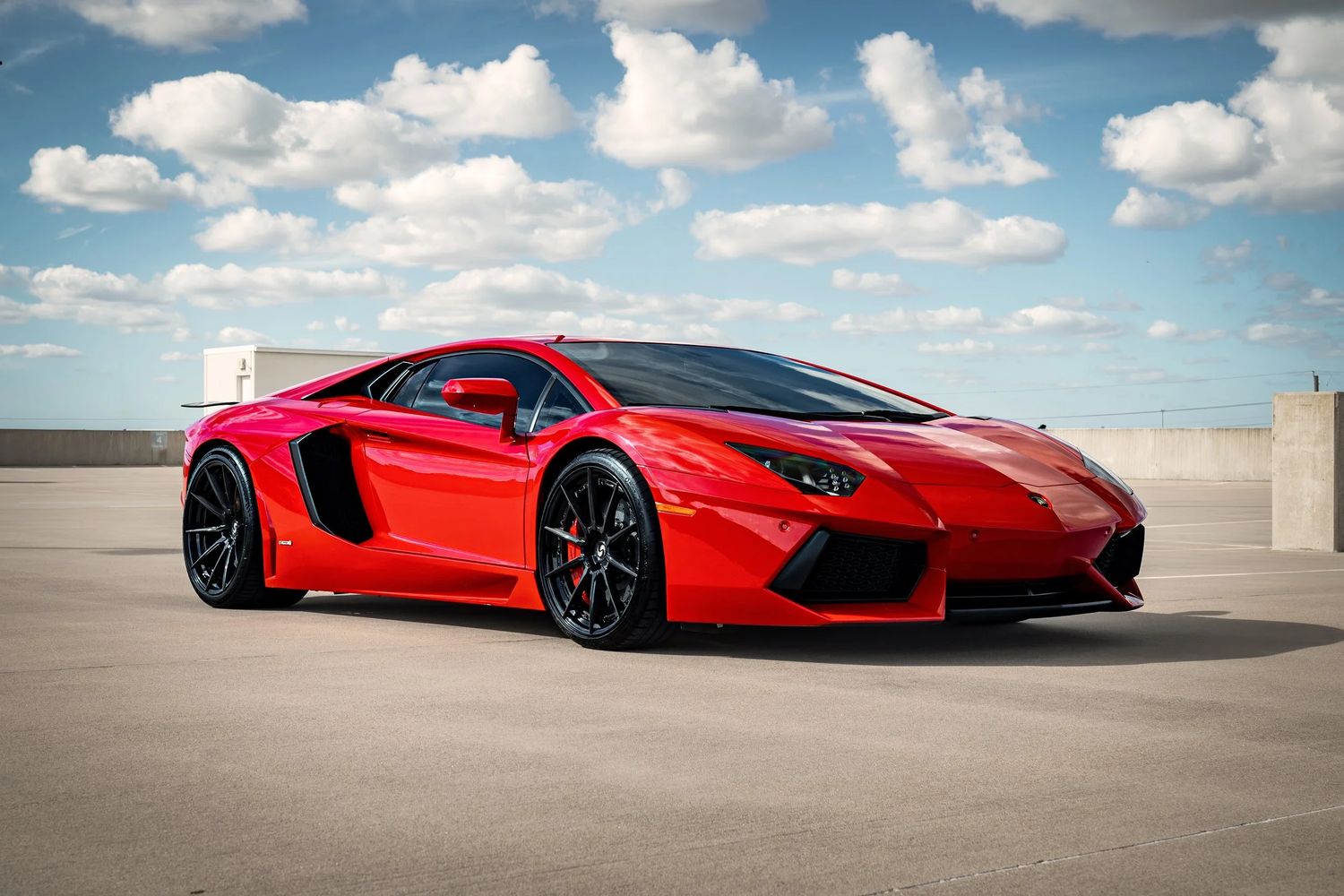 Red Lamborghini Aventador photographed outdoors