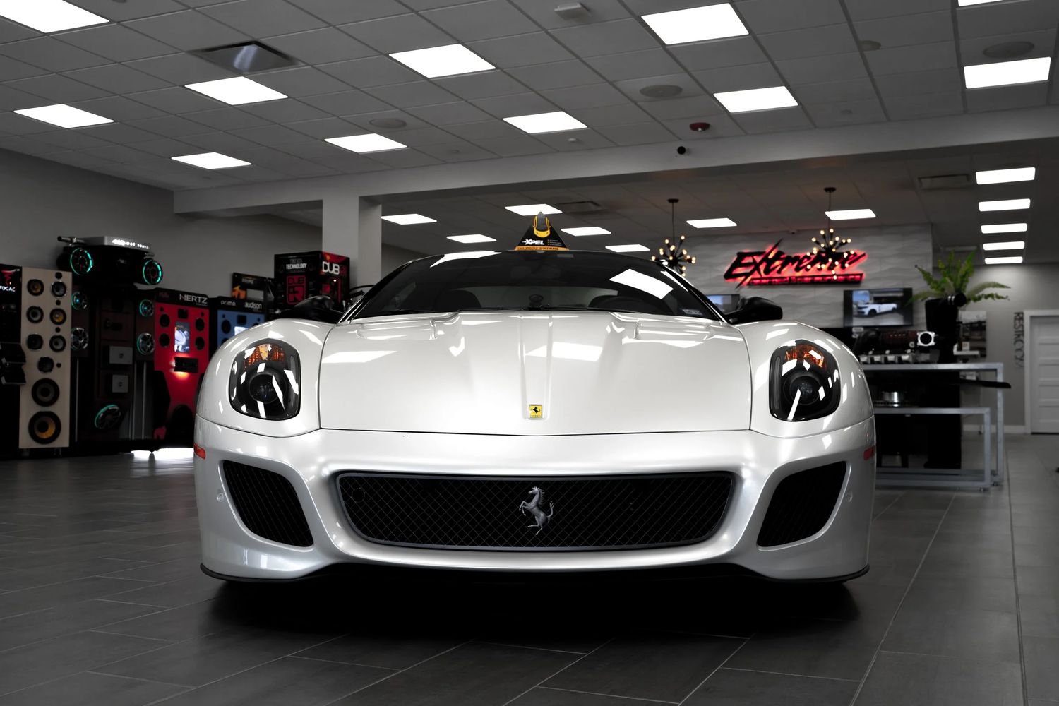 White Ferrari 599 GTB parked inside the Extreme showroom