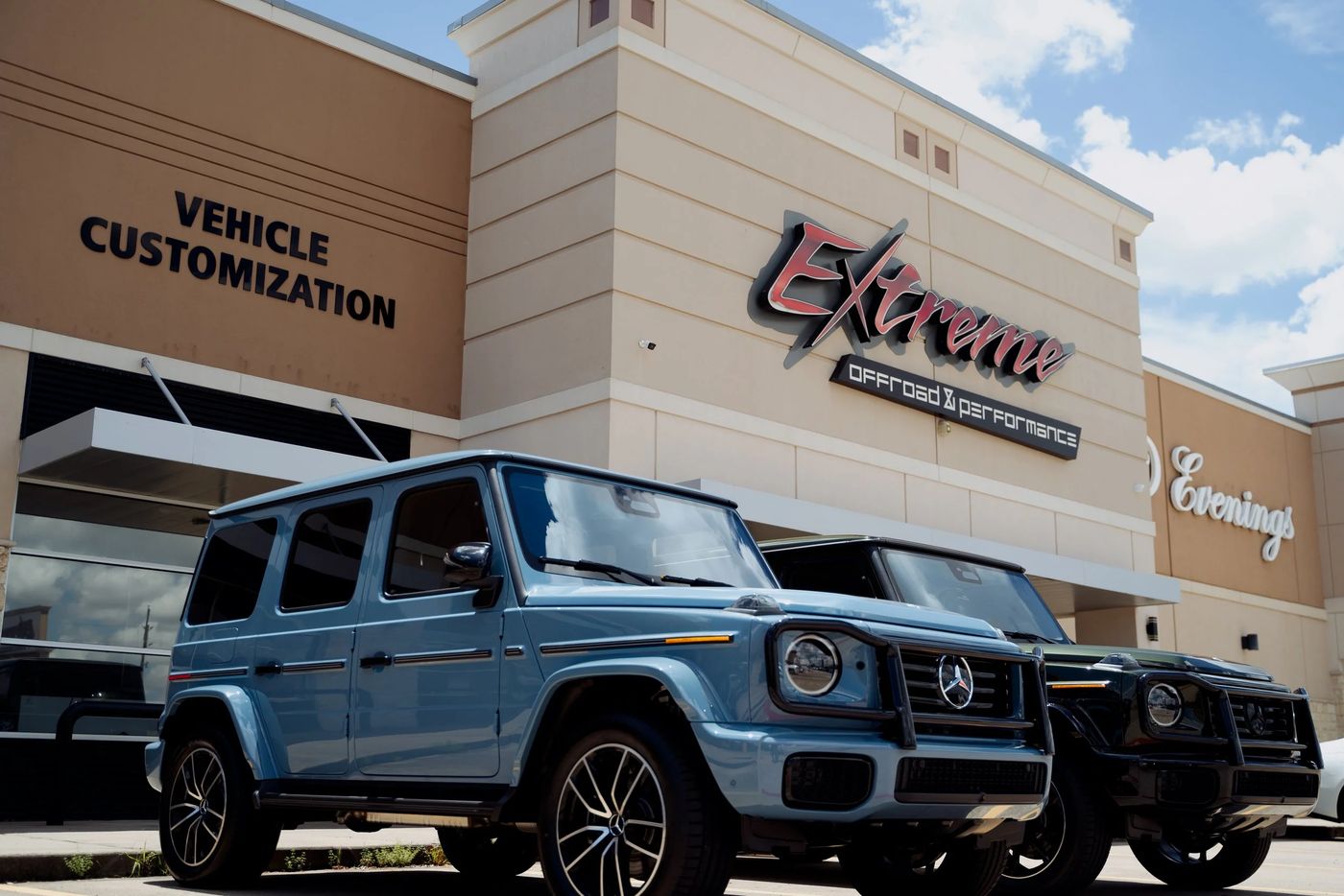 The Extreme Offroad and Performance building with a customized Mercedes G-Wagon parked in front